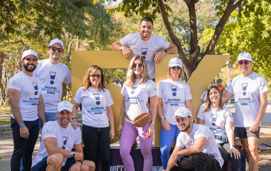 Group of Brugal colleagues out walking wearing branded Alcohol Responsibility Week t-shirts