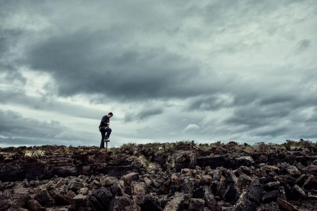 A man cutting peat on the Hobbister Moor peatland