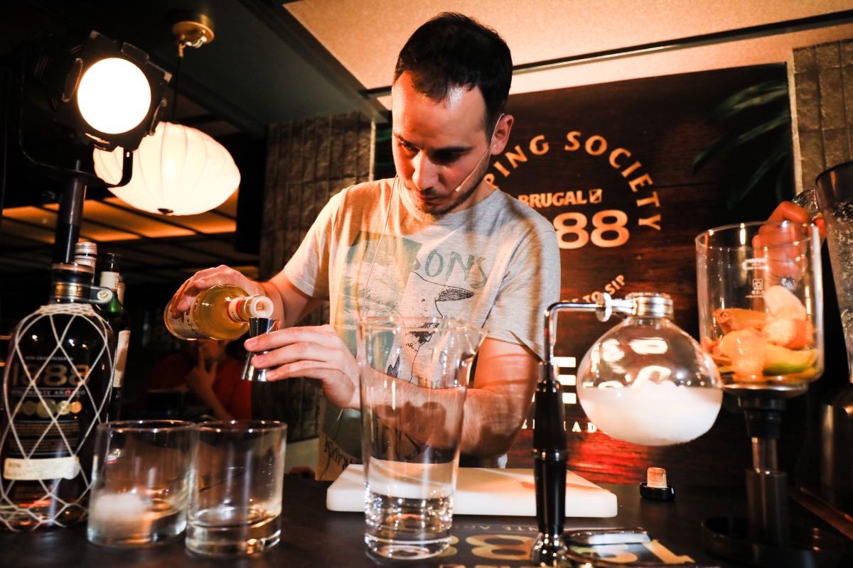 Bartender mixing a Brugal cocktail in a bar