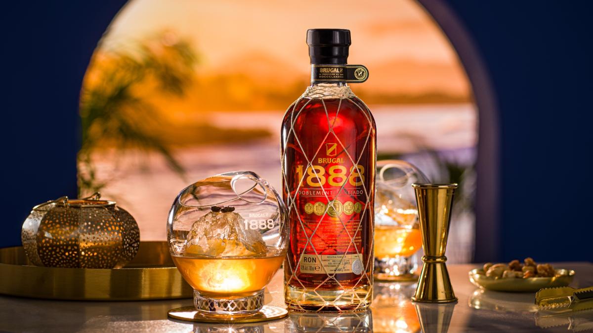Brugal 1888 bottle with cocktail glass next to it 