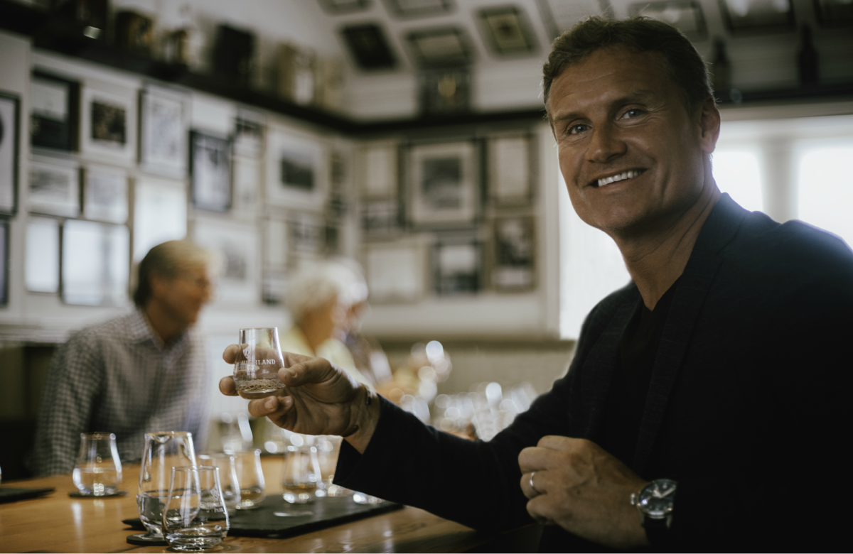 F1 driver David Coulthard in the Highland Park tasting room holding a dram