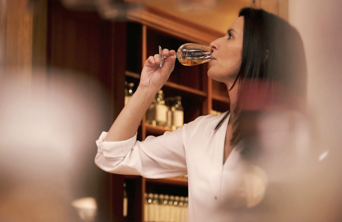 Shot of The Famous Grouse Master Whisky Blender Kirsteen Campbell tasting a whisky in the sample room