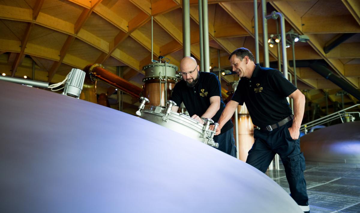 Two colleagues inspecting a washback at The Macallan Distillery