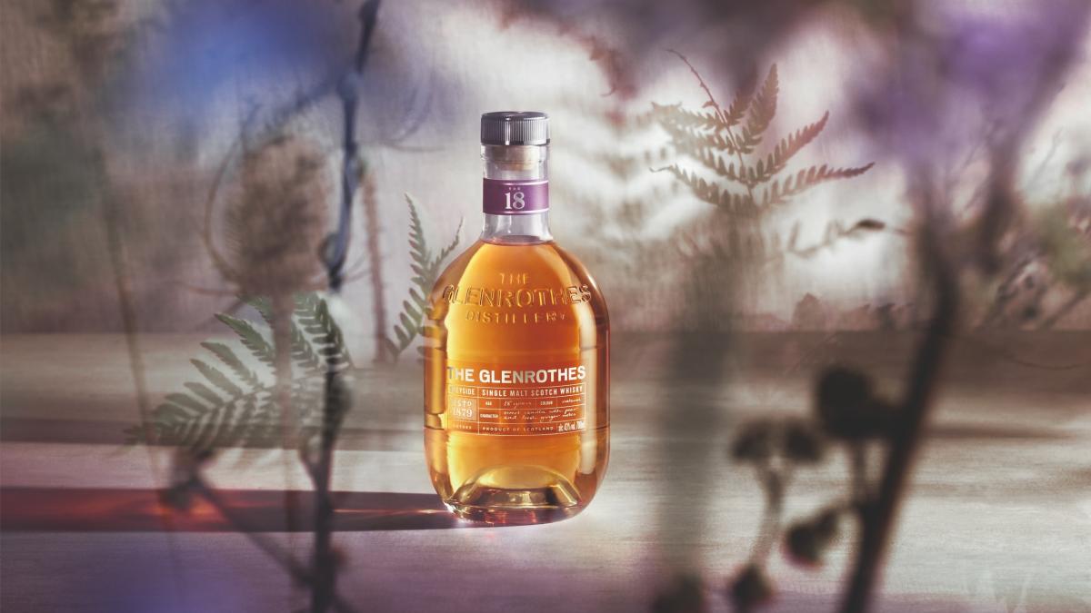 Bottle of The Glenrothes 18 Year Old surrounded by projections of heather
